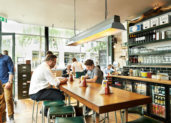 The inside of Honest Burgers at Oxford Circus busy with customers