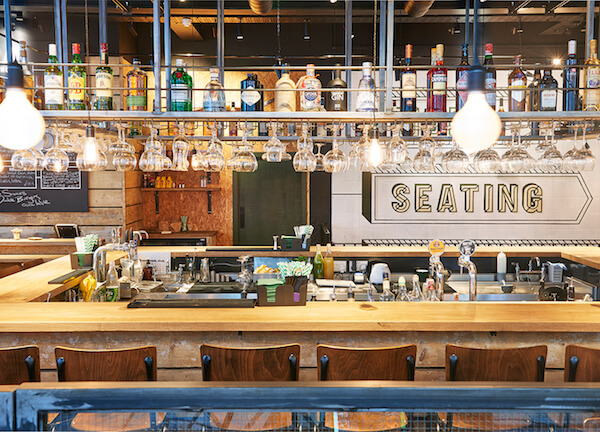 Well lit bar and seating inside Honest Burgers Bank
