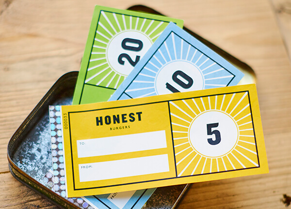 Honset Burgers vouchers in a tin casing