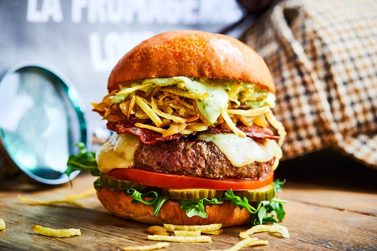 Honest beef burger with pancetta bacon, emmental cheese, caramelised onions and garlic mayo