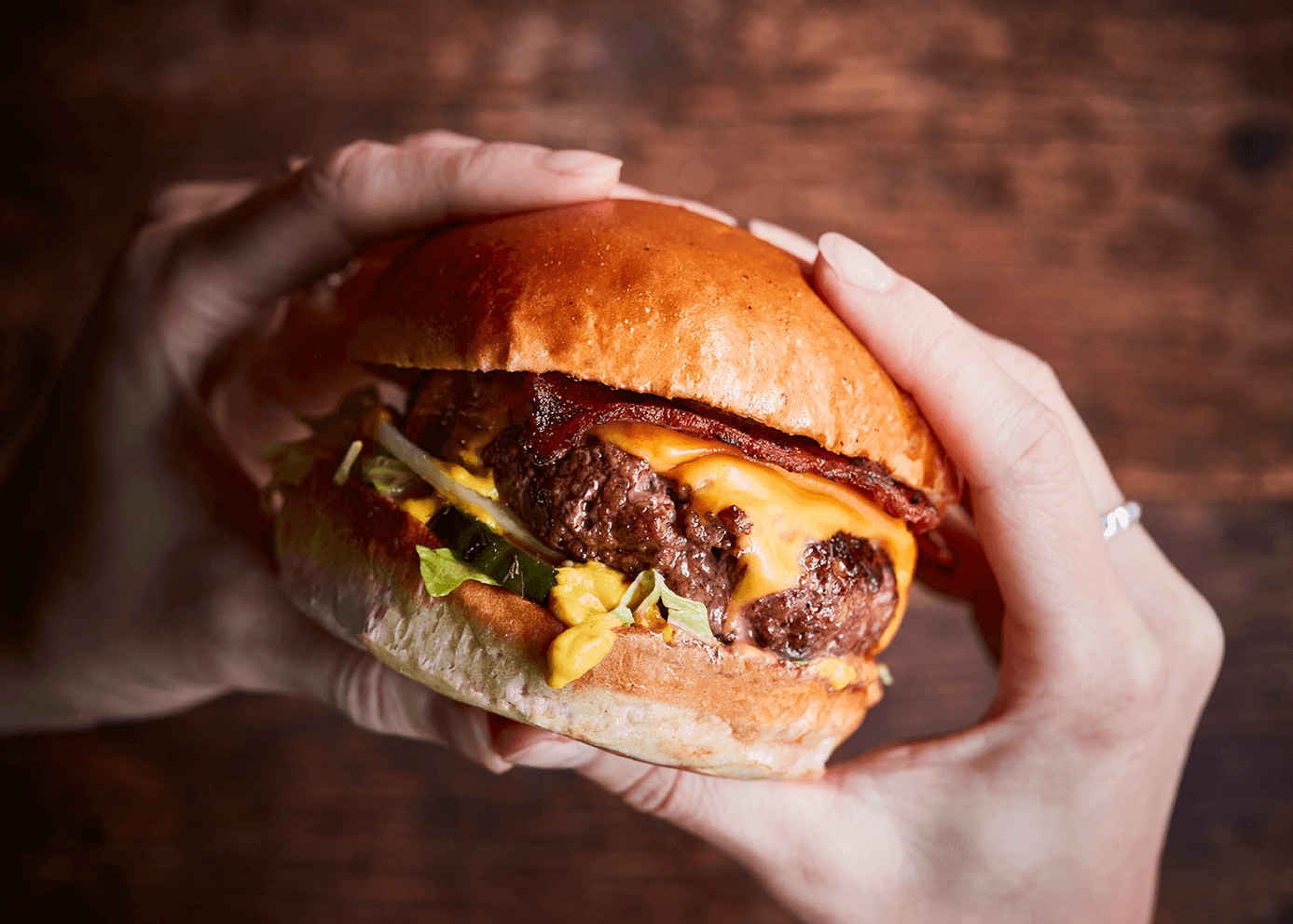 Tribute burger in hands