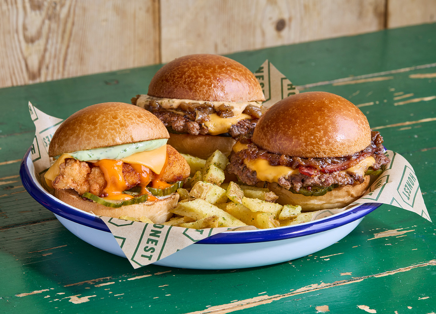 Honest mighties slider burgers on plate with chips