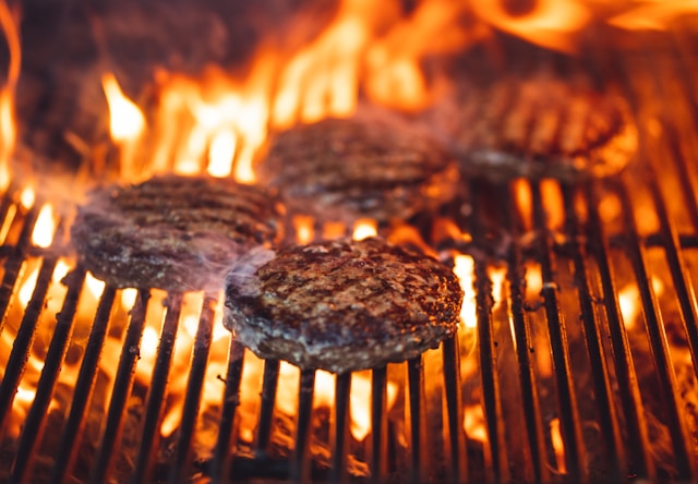 Burgers cooking on a BBQ